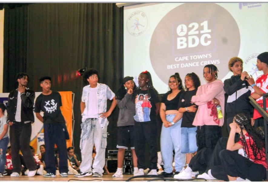 Dream Chasers crew on stage at a dance competition